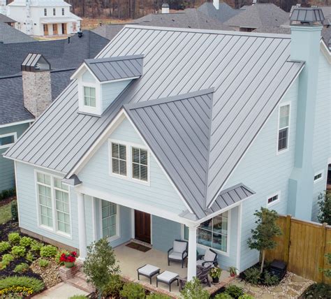 white house with light gray metal roof|white standing seam metal roof.